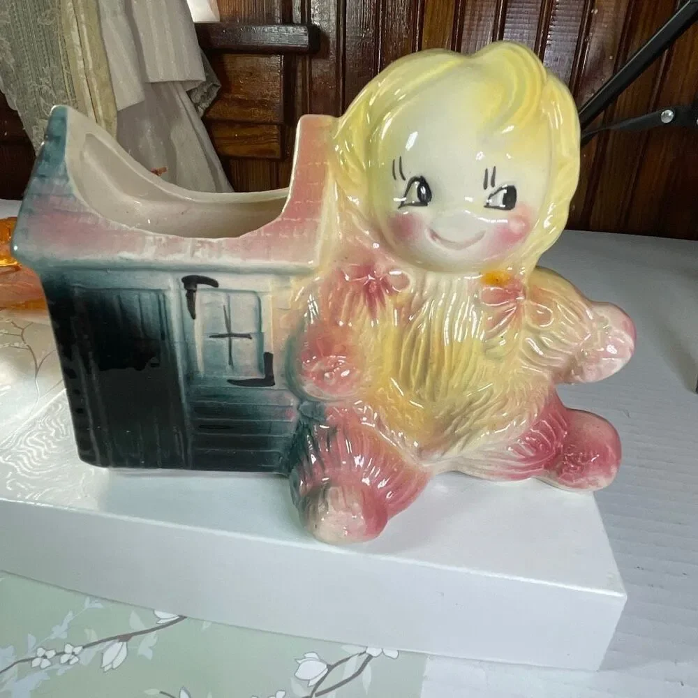 Vintage ceramic American Bisque Yarn Doll planter.